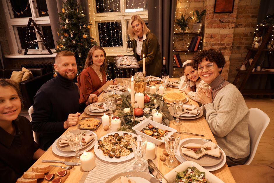 Family sitting together around a holiday dinner table