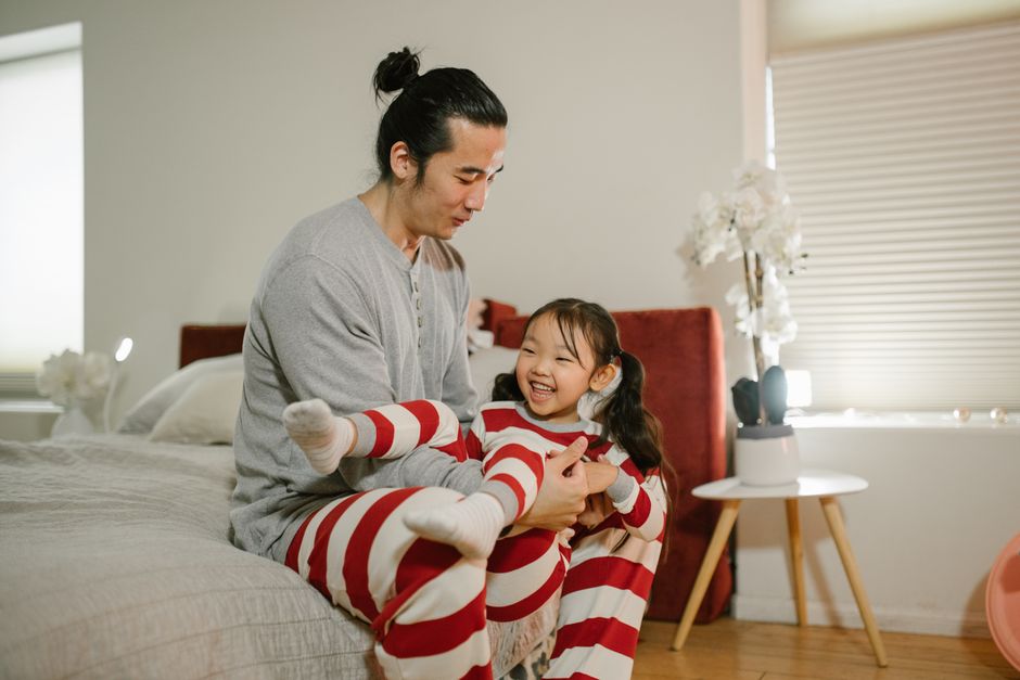 Parent and child playing together on the floor at home