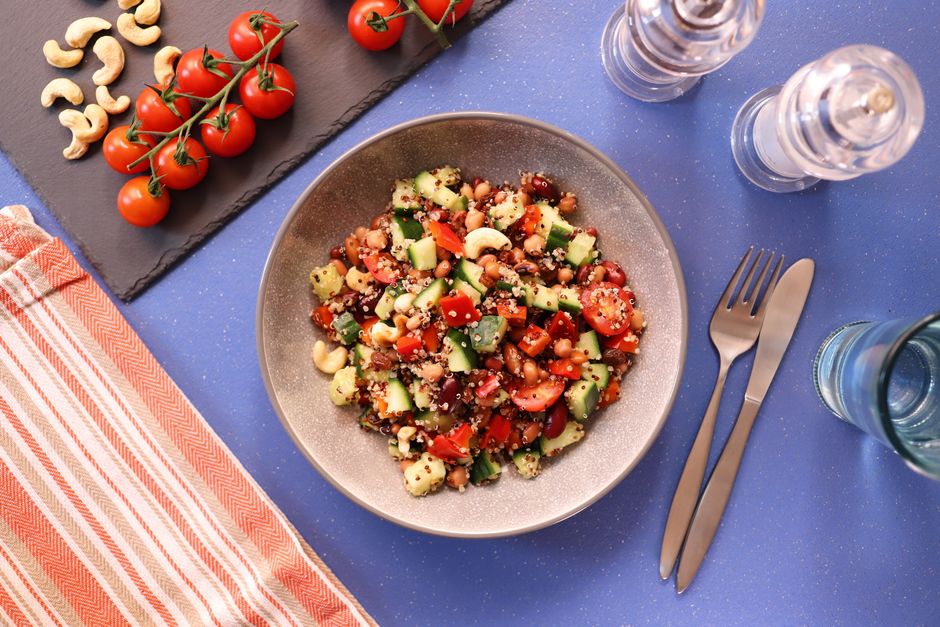 Plate of chickpea and tomato salad with cutlery