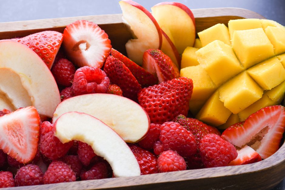 Platter of fresh fruit including mango and strawberries